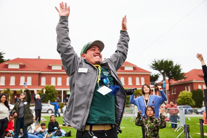 Male Presidio Trust staff member waving