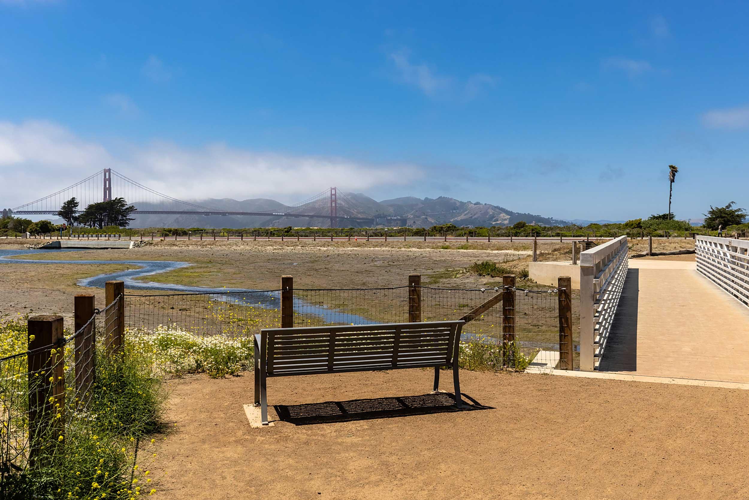 Quartermaster Reach Marsh in the Presidio with a bench and pedestrian bridge. Photo by Charity Vargas.