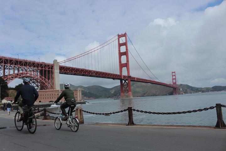 Two bicyclists near Fort Point National Historic Site in the Presidio.