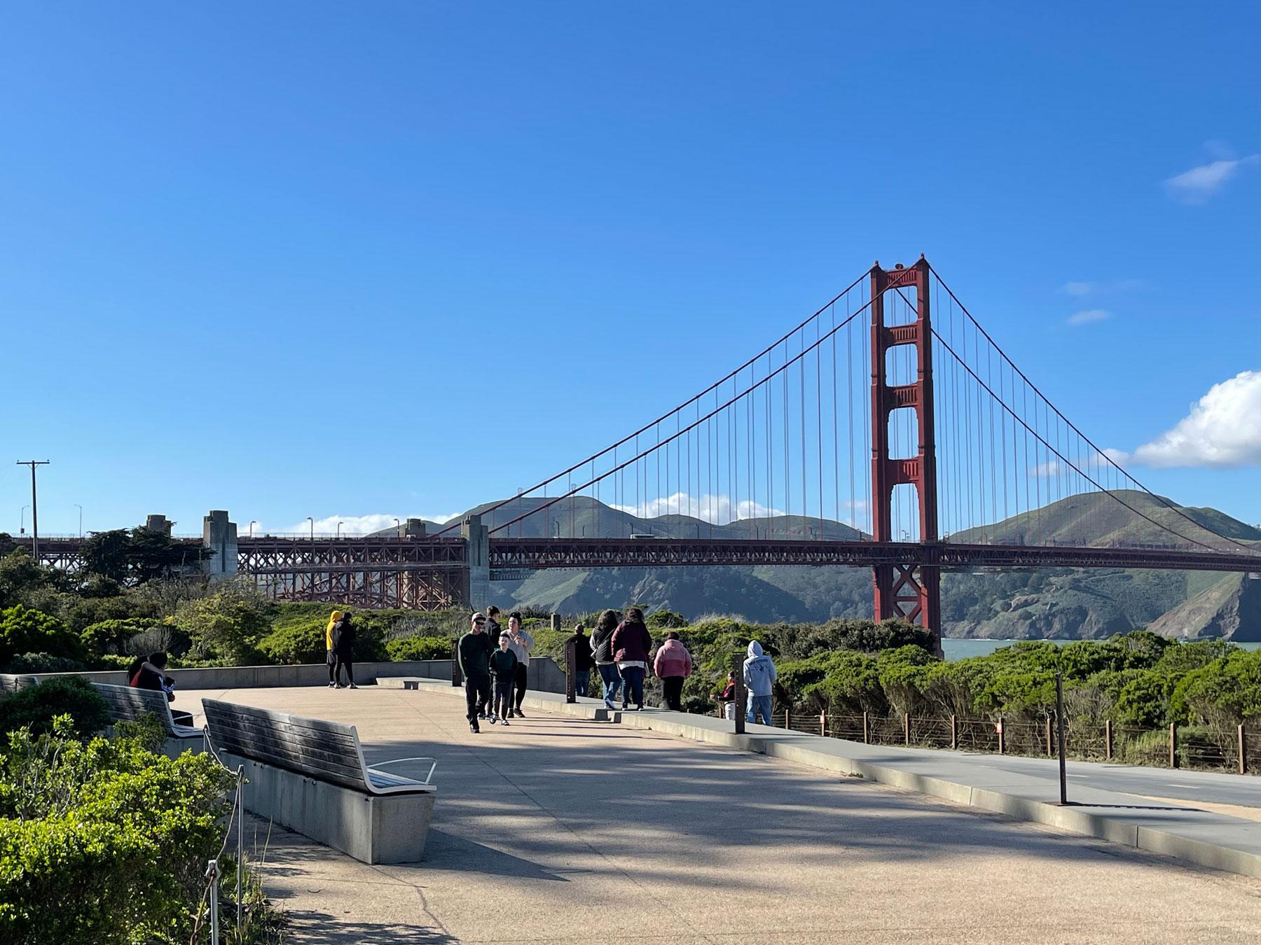 Visitors on the Presidio Promenade near Battery East overlooking the Golden Gate Bridge.