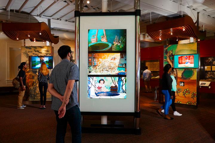 Visitors enjoying exhibits at The Walt Disney Family Museum. Photo courtesy of the museum.