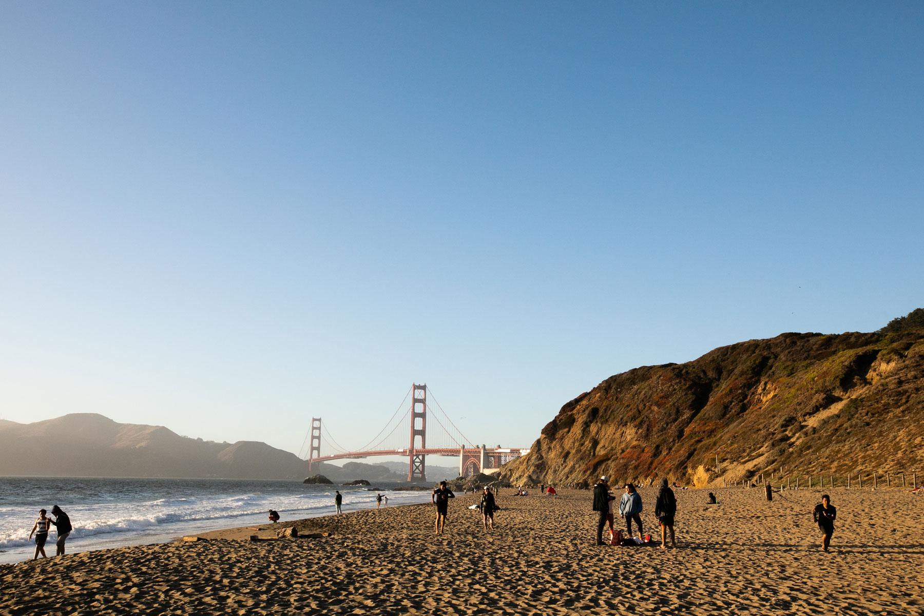 Visitors enjoying the sand and waves at Baker Beach. Photo by Myleen Hollero.