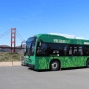 The Presidio Go shuttle bus with the Golden Gate Bridge in the background.